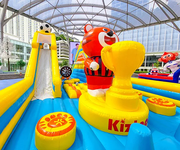 Children having fun on an inflatable slide at Jumptopia