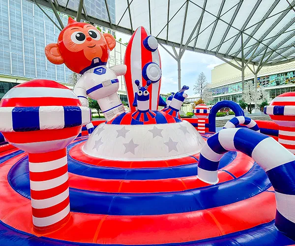Kids jumping and playing together in an inflatable park